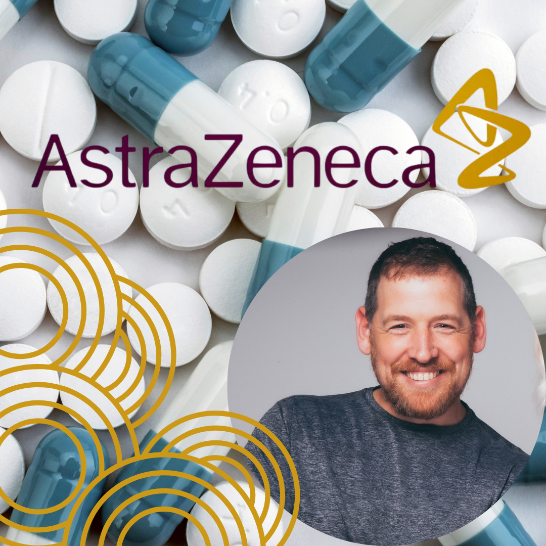Jamie McAnsh smiling in front of AstraZeneca branding and capsules, symbolising celebration and success.